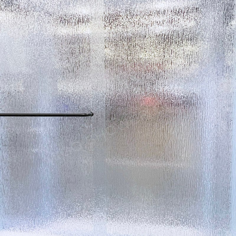 Rain patterned shower glass